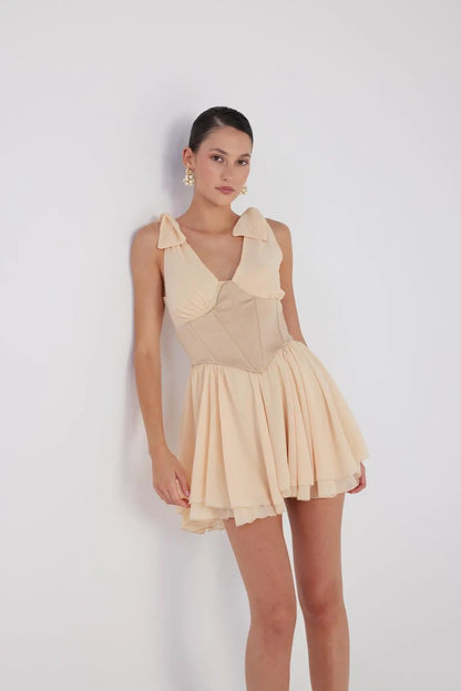 Fiona Beige Ruched Mini Dress with Pleated Skirt by Holly Lolly