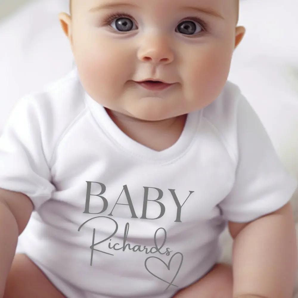 Personalised Surname Heart Baby Outfit: Bib, Vest, Baby Grow by Aye Do Gifts