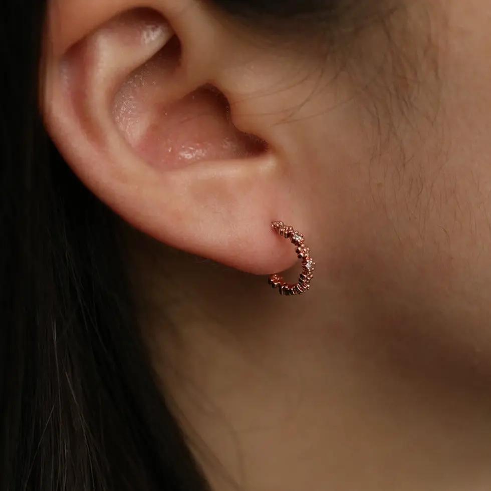 Flower cubic semi-hoop earrings by Nabi London