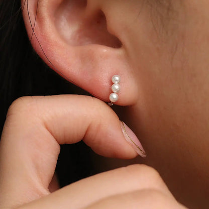 Triple Pearls Huggie Earring by Nabi London