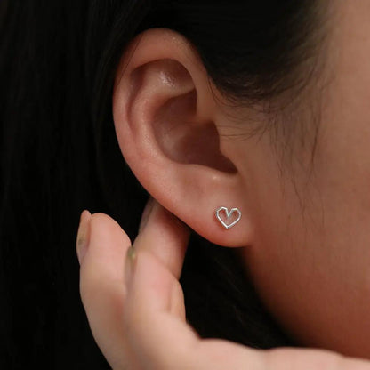 Angled heart stud earrings by Nabi London