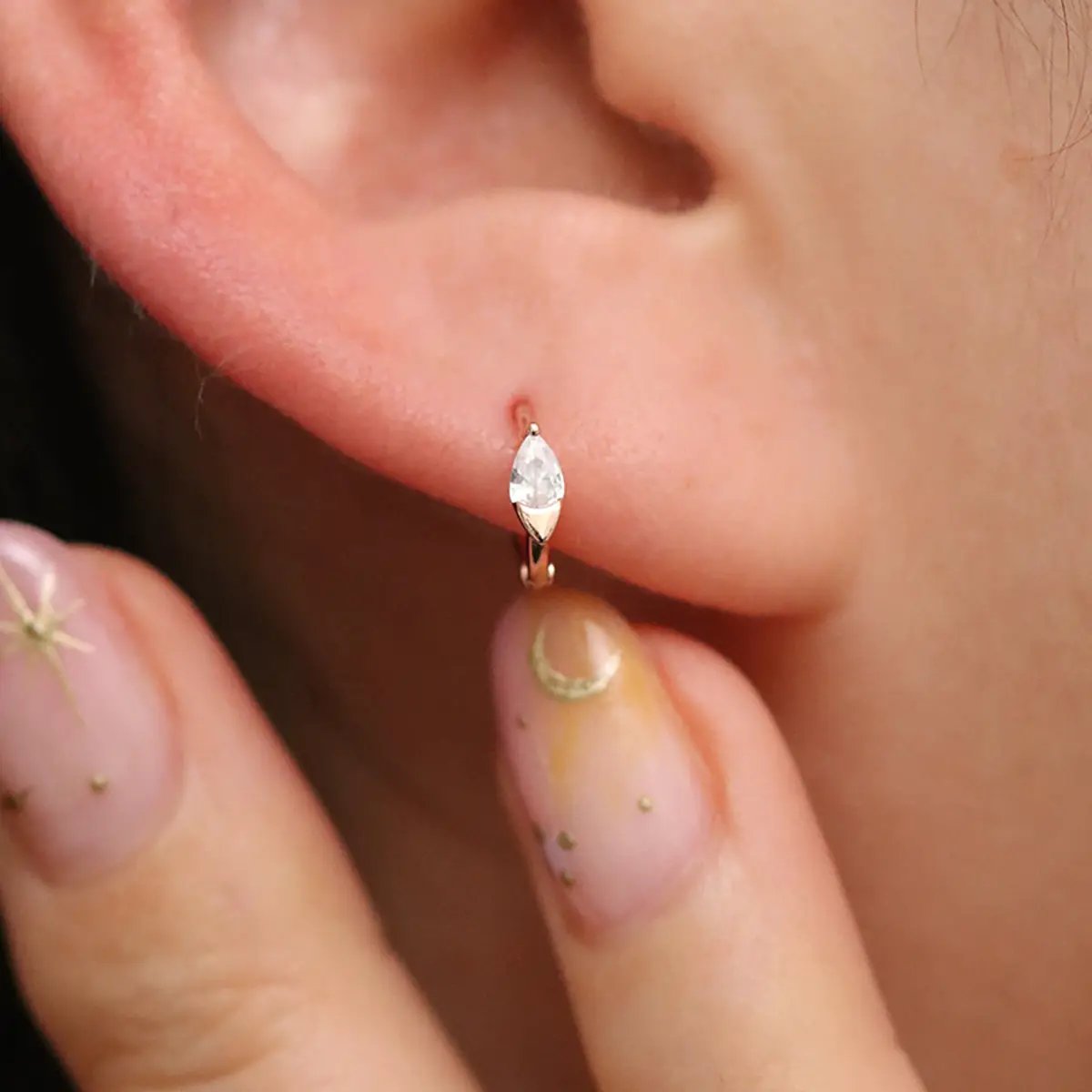 Teardrop Cubic Huggie Earring by Nabi London