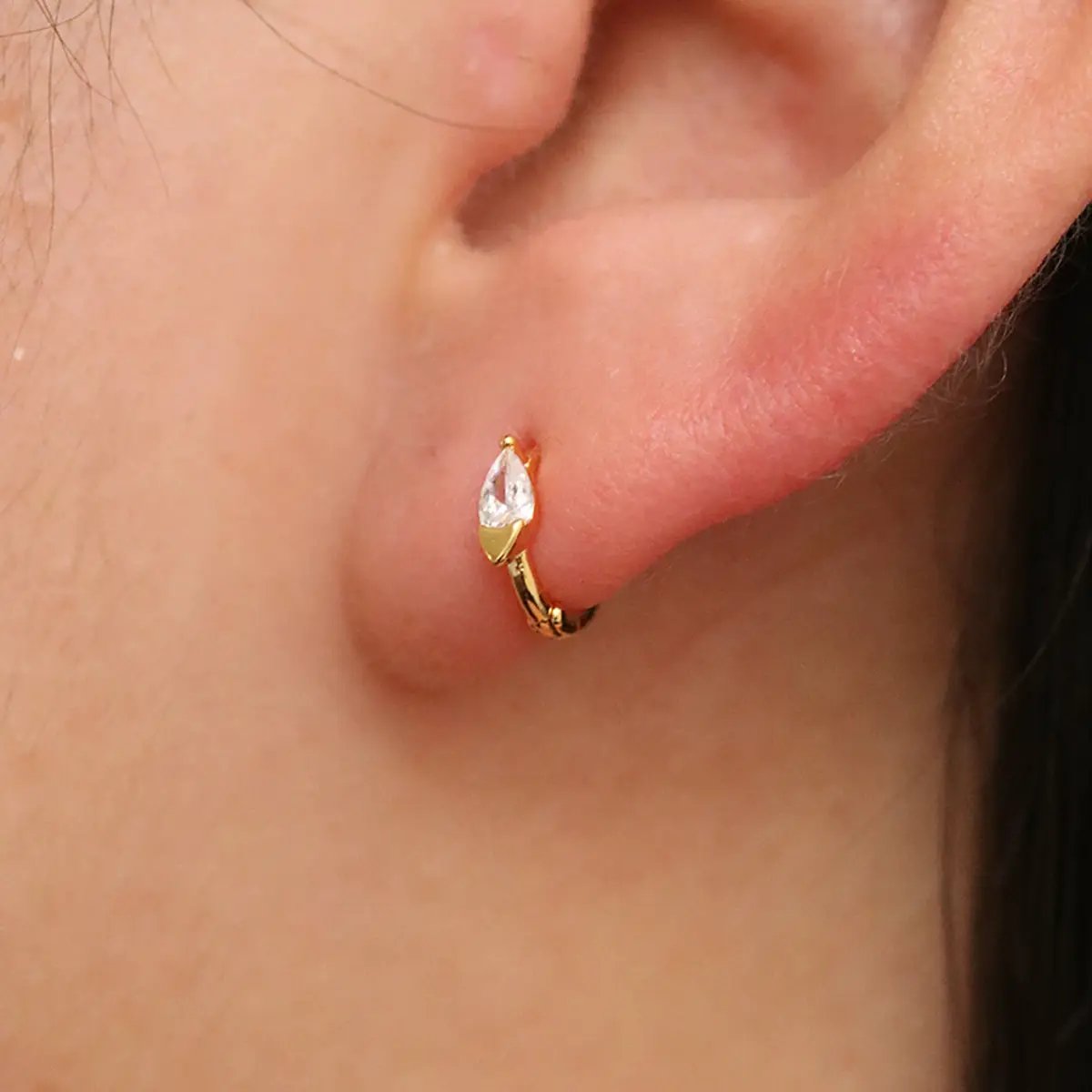 Teardrop Cubic Huggie Earring by Nabi London