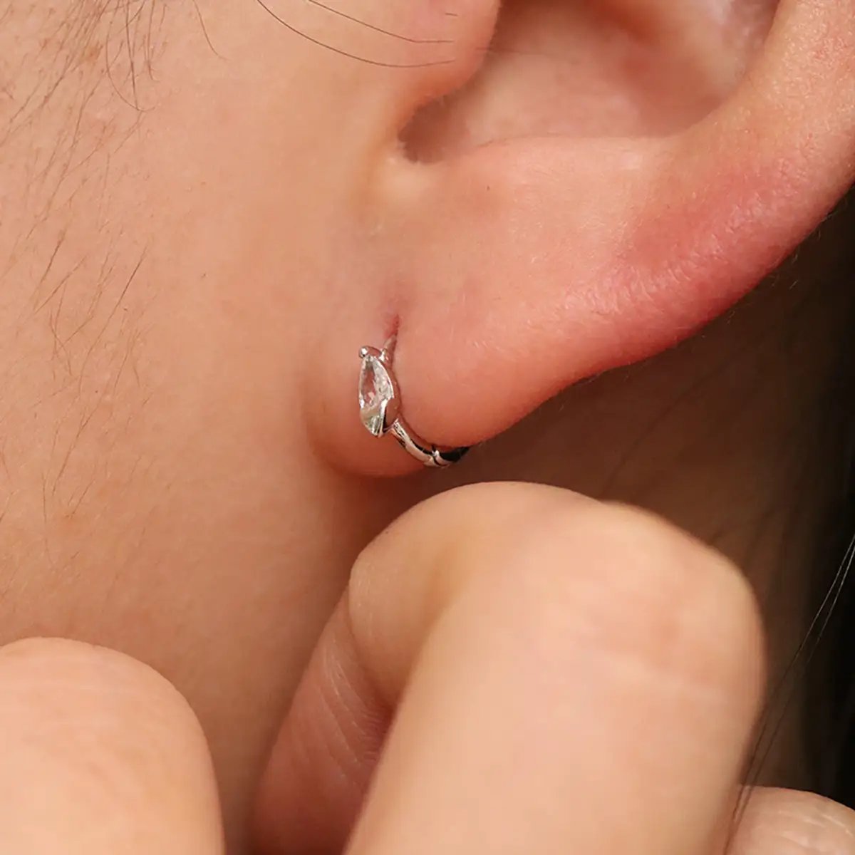 Teardrop Cubic Huggie Earring by Nabi London