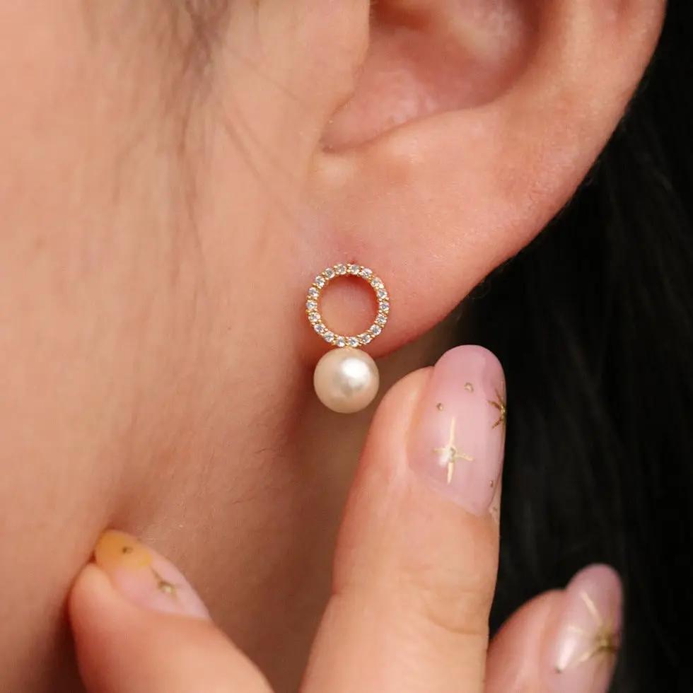 Circle pearl drop earrings by Nabi London