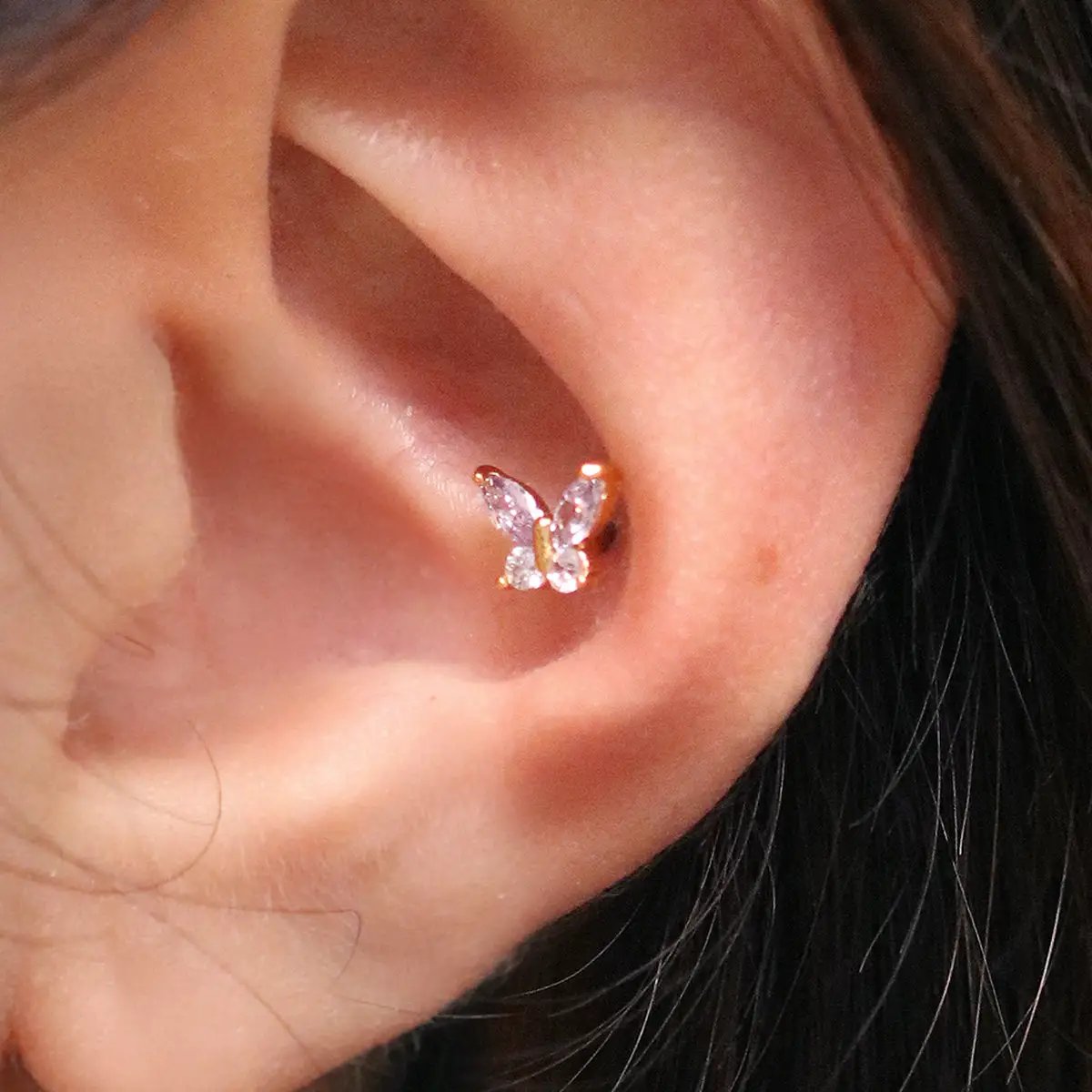 Purple butterfly piercing by Nabi London