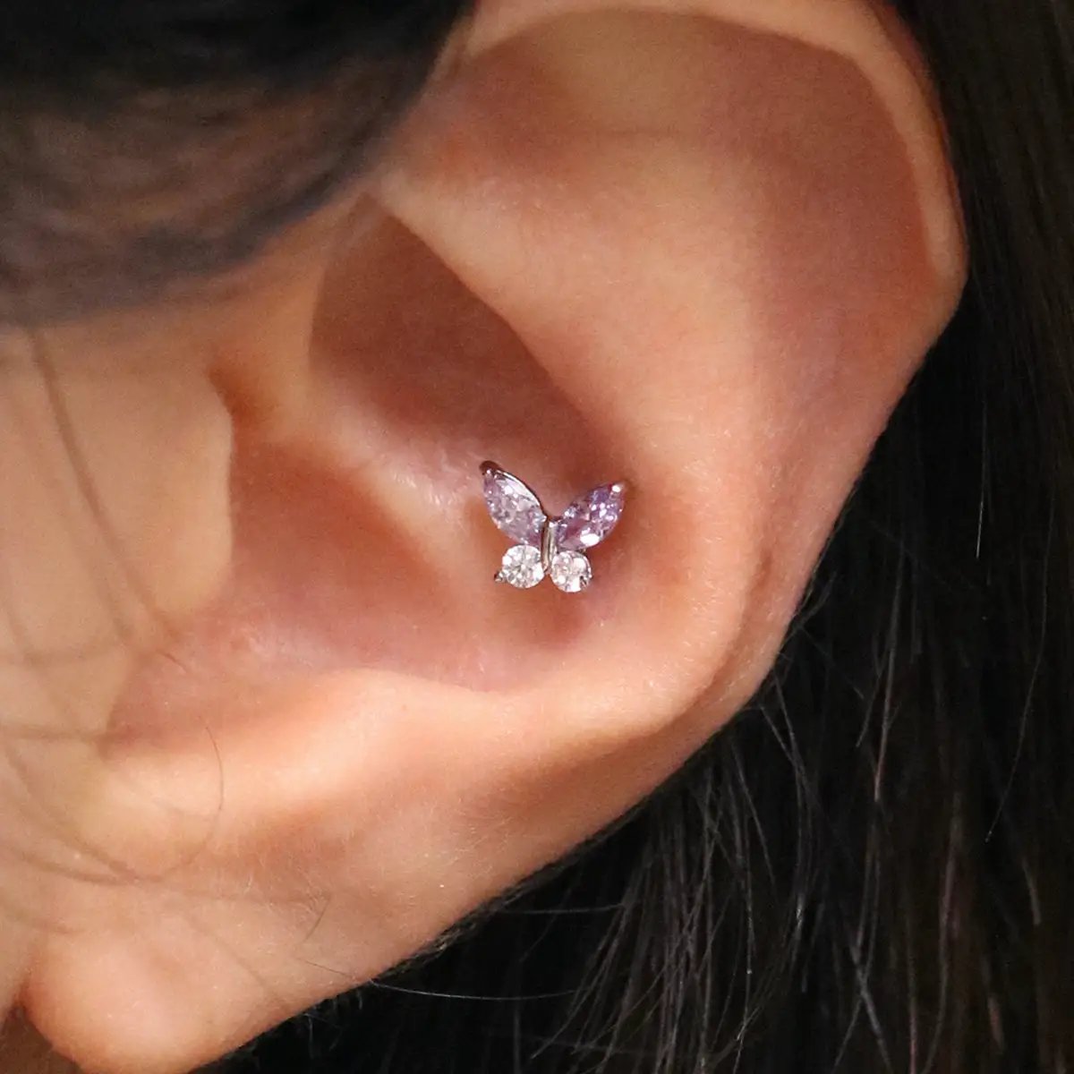 Purple butterfly piercing by Nabi London