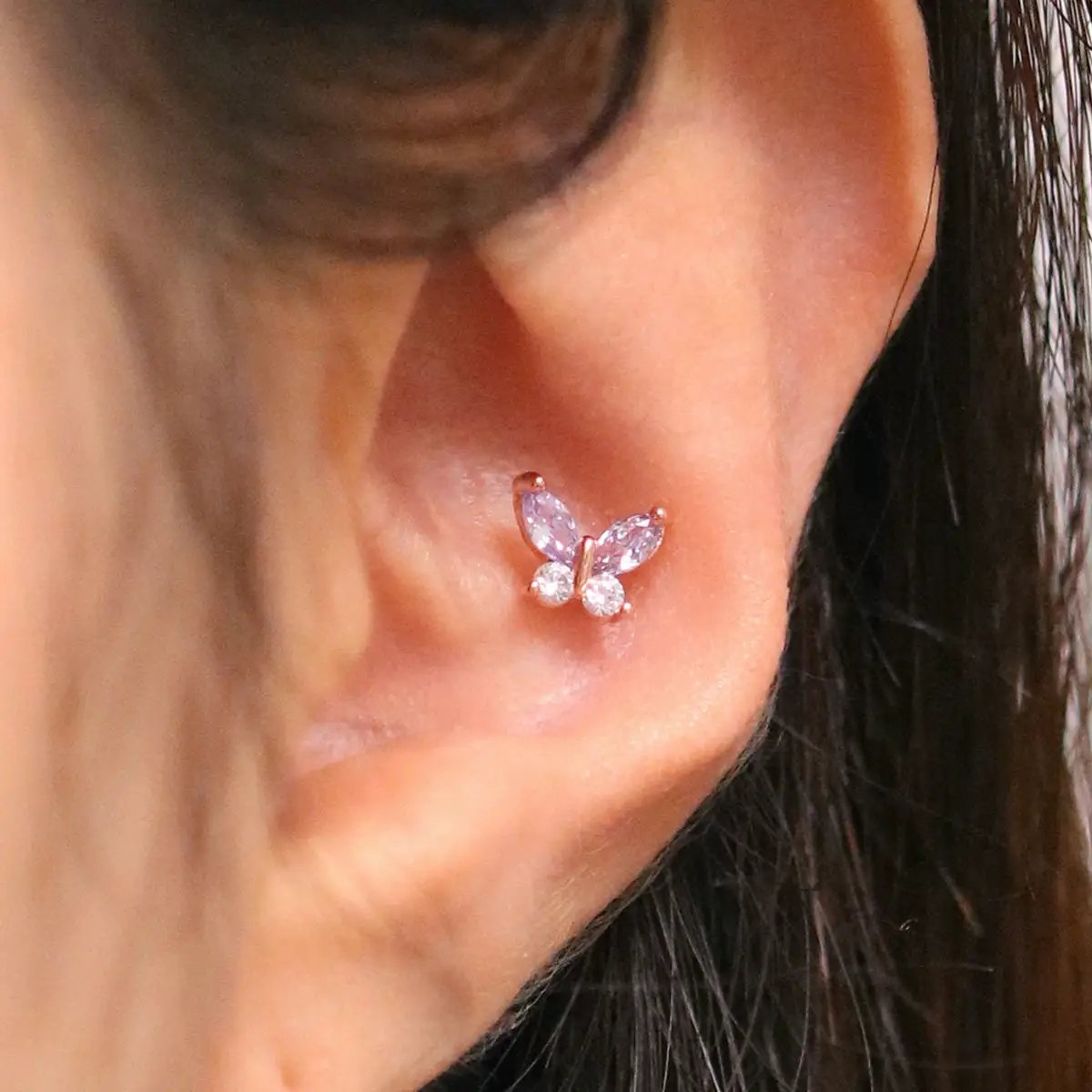 Purple butterfly piercing by Nabi London