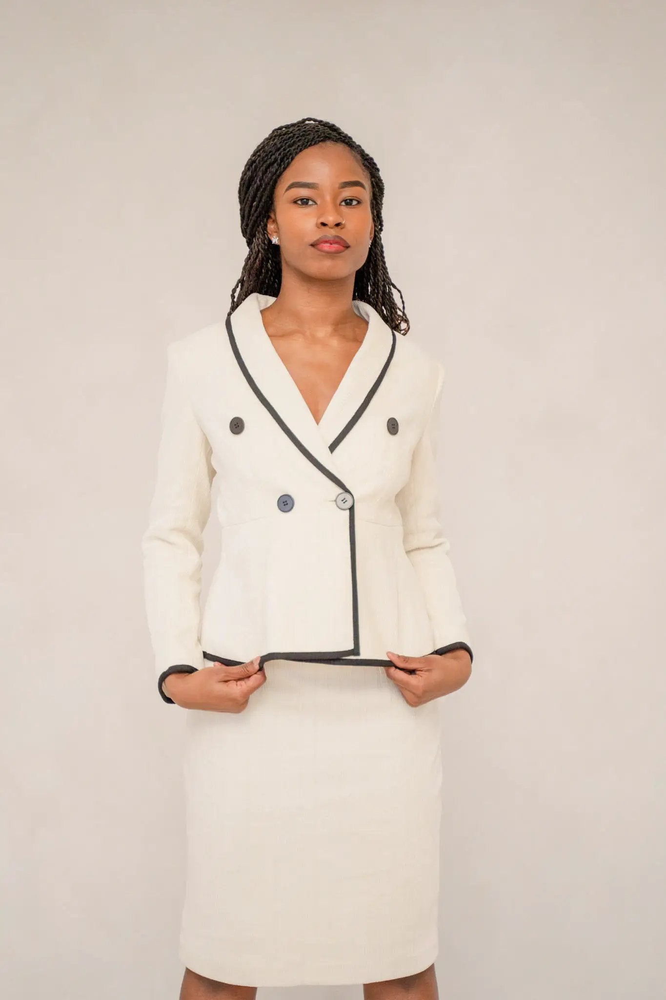 The beige piped peplum tweed skirt suit by EDKAY COLLECTION UK